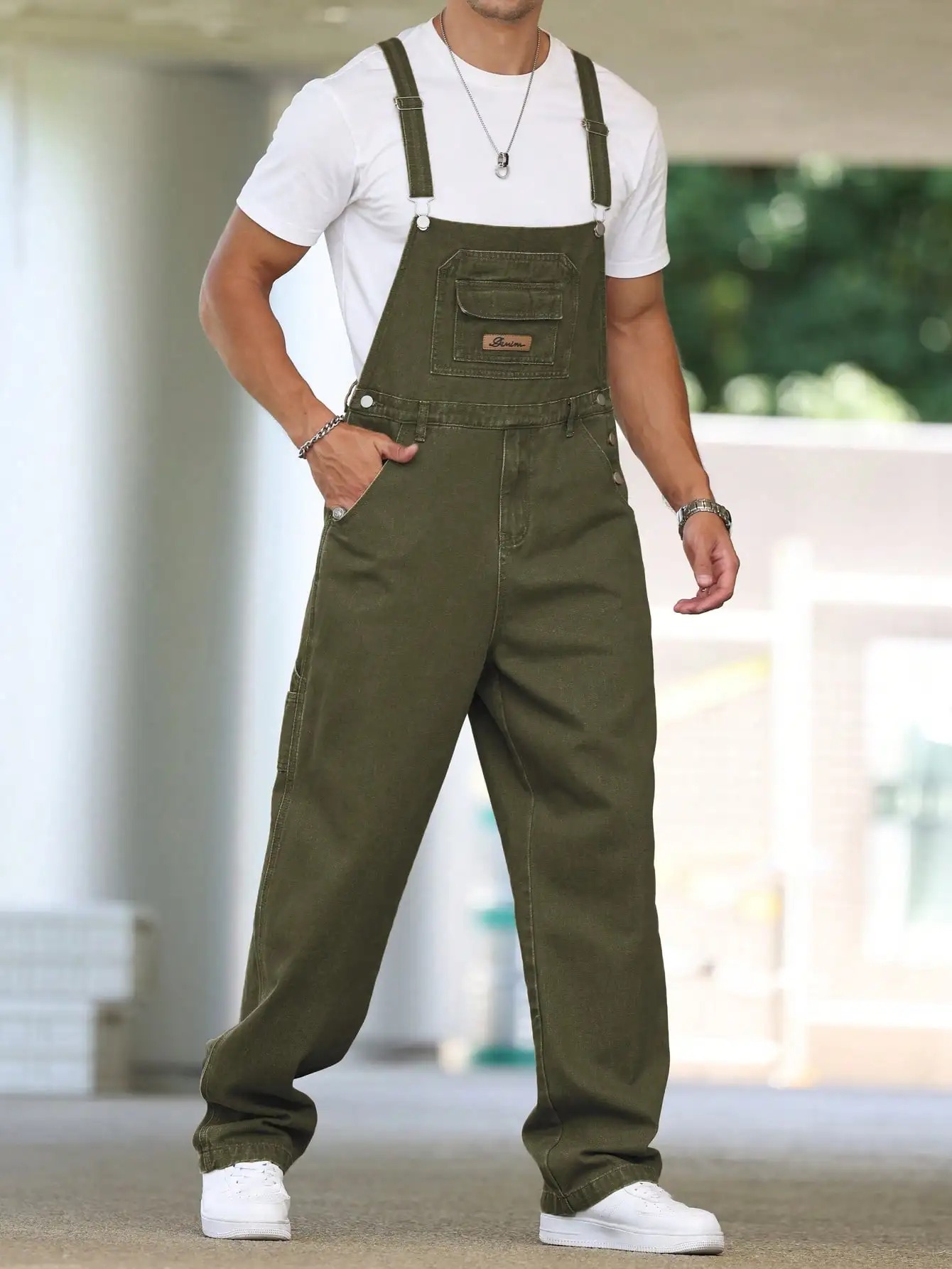 salopette jean large homme vert détail bretelles